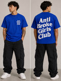 Person wearing a blue 'Anti Broke Girls Club' t-shirt with text on front and back, standing against a neutral background.