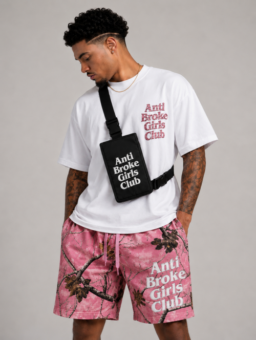 Person wearing 'Anti Broke Girls Club' branded clothing and accessories on a gray background